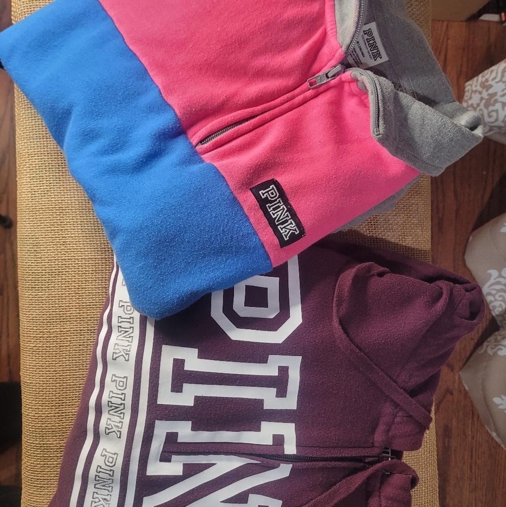 2 pink sweaters